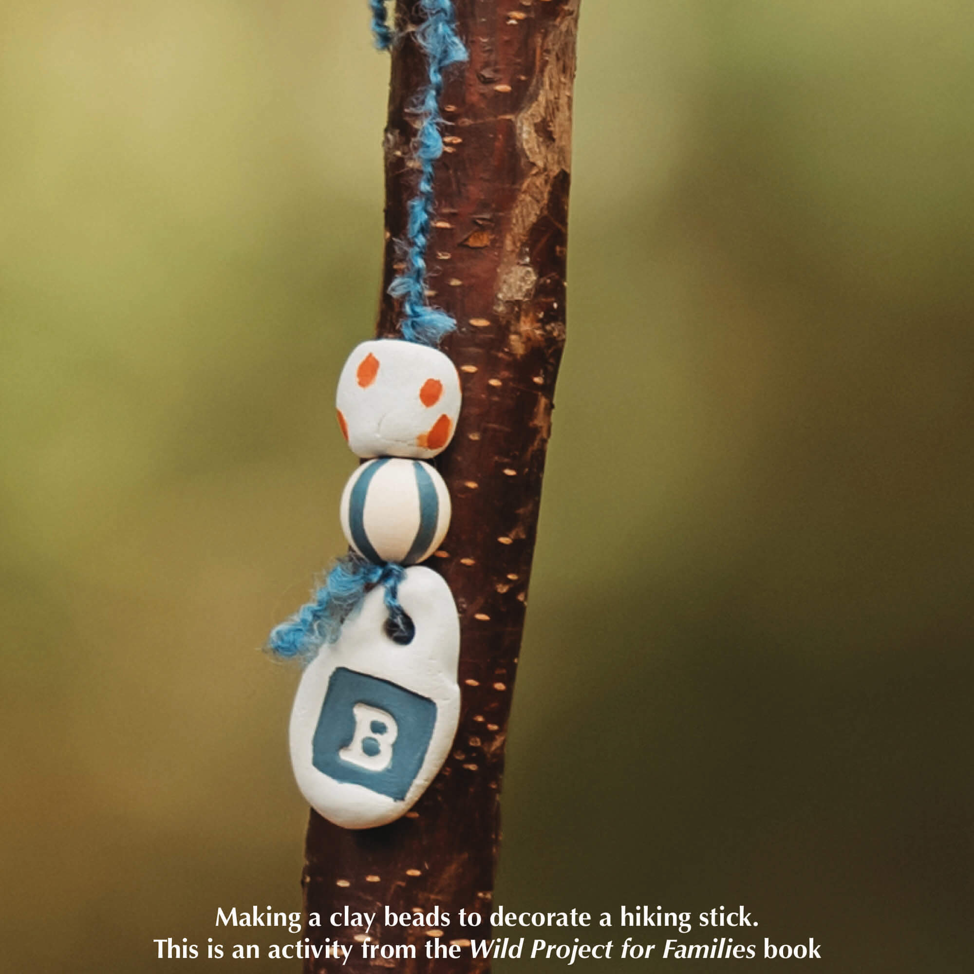 small bead made with air dry clay and decorated with paint pens for nature craft from Your Wild Books