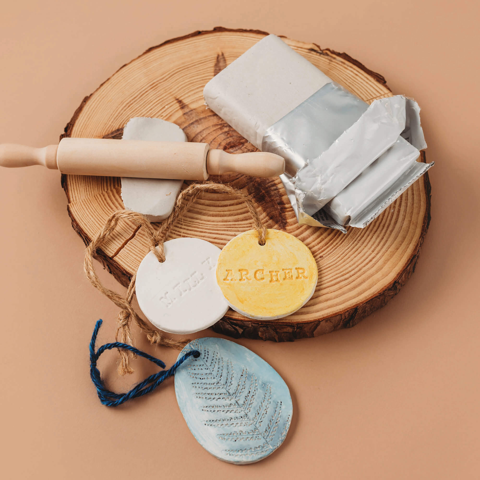 air dry clay white natural gift tags with names and coloured with watercolour paint from Your Wild Books