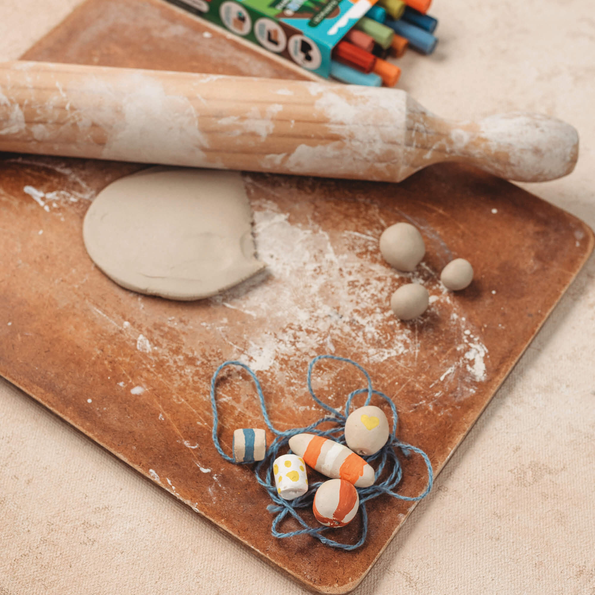 air dry clay white natural small beads made with clay and decorated with paint pens from Your Wild Books