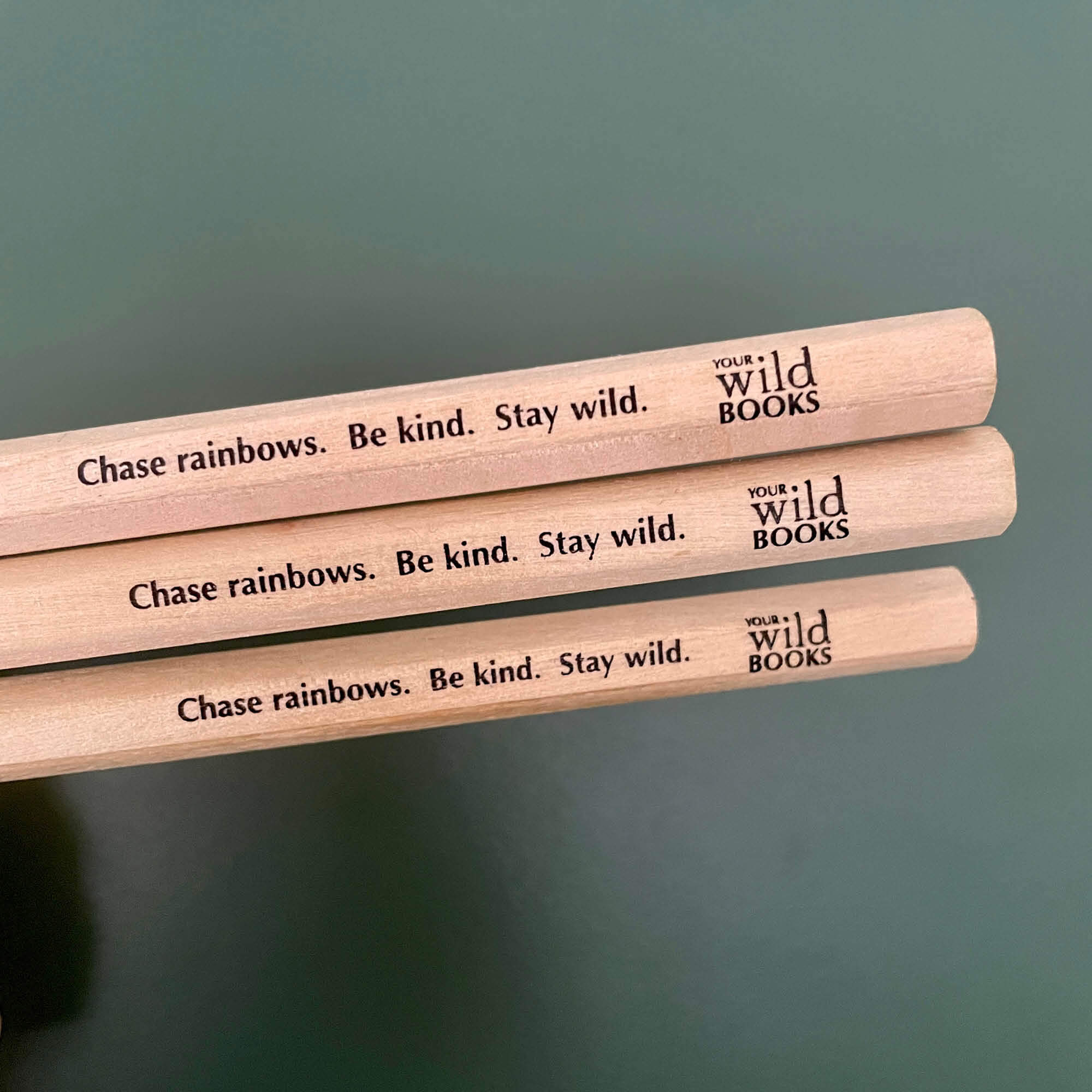 4 colour rainbow pencil with thick FSC certified timber casing for easy grip. Engraved with quote - Chase rainbows. Be kind. Stay wild. And the Your Wild Books logo.