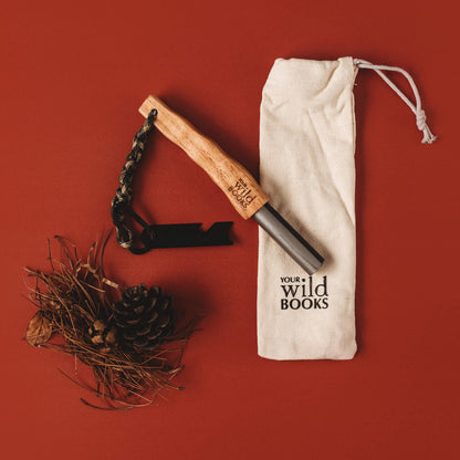 Flatlay of fire starter with wooden handle with kindling made by Your Wild Books