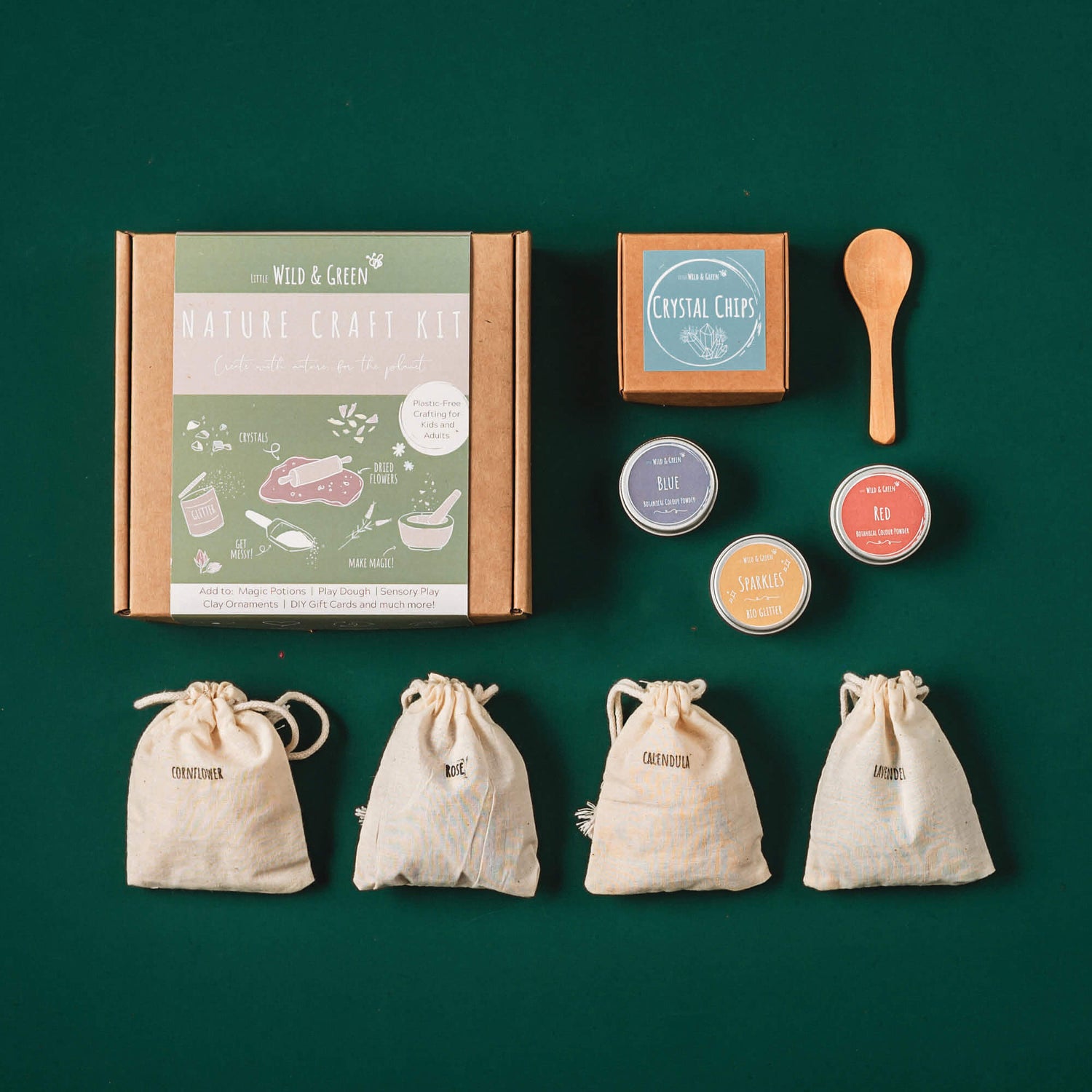 Nature craft kit by Little Wild and Green made with all natural materials including 4 bags of petals, 2 paint powders, 1 eco glitter, a box of crystal chips and a wooden spoon. perfect for nature crafting for kids including playdough, clay and magic potions from Your Wild Books