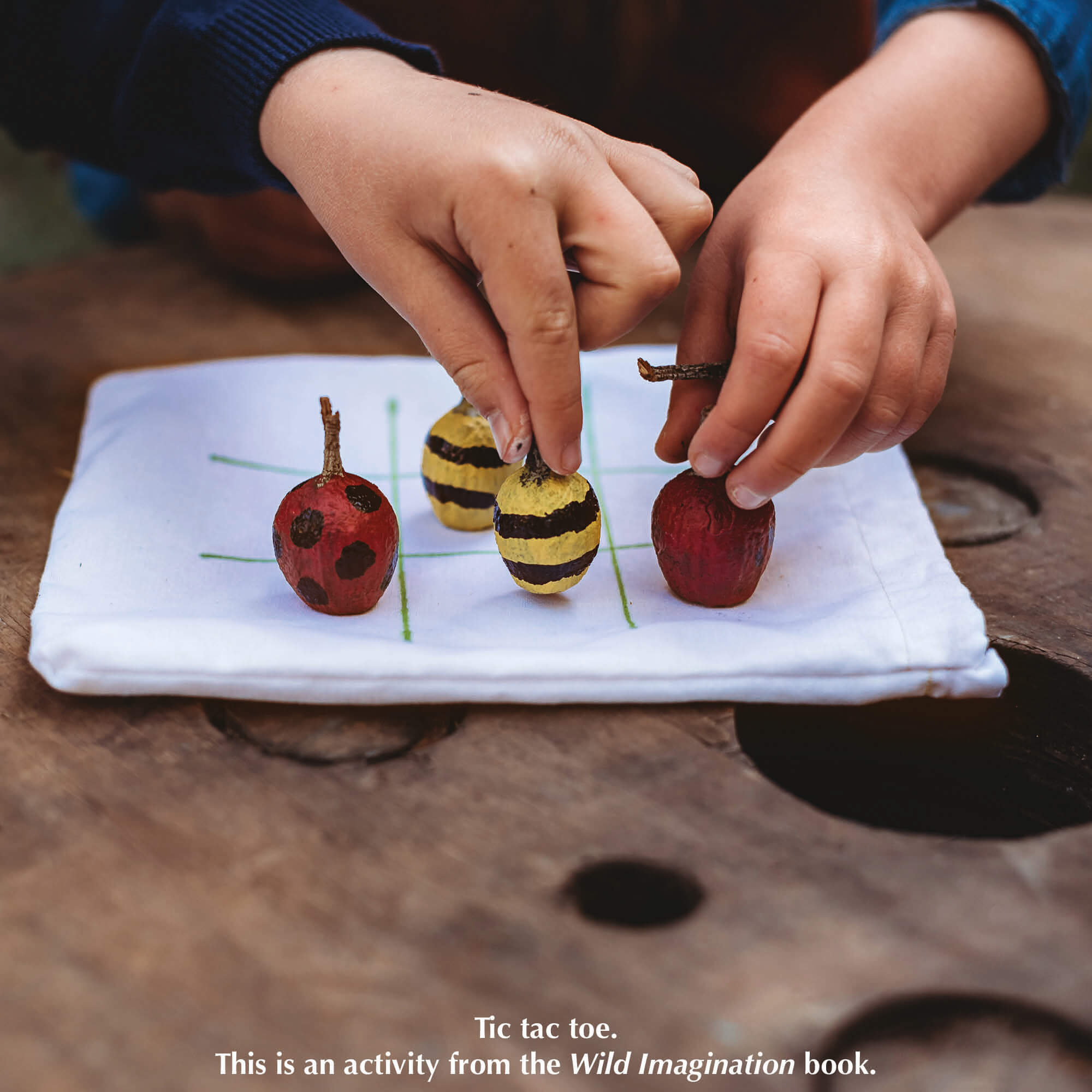 Tic tac toe using gumnuts using paint pens as featured in Nature Craft Starter Pack from Your Wild Books includes Wild Imagination book, Wild Child book, paint pens in classic colours and an opinel beginners whittling knife. Save 20%