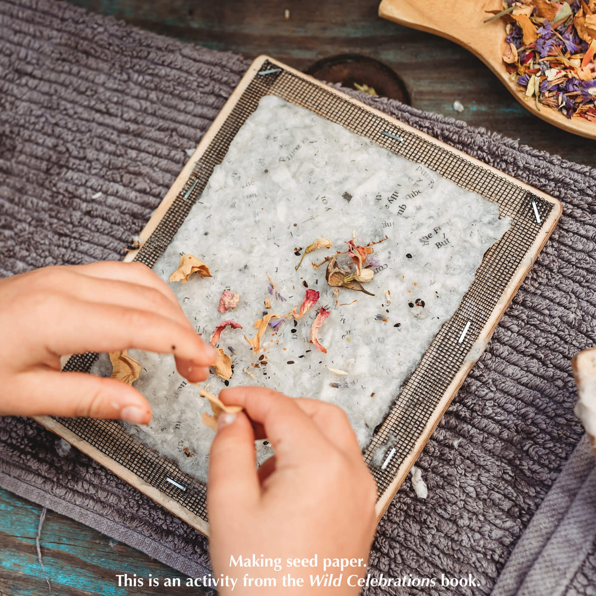 Child making paper with the Paper Making Bundle includes Wild Celebrations book, Paper Making kit from Poppy and Daisy and two packets of seeds from Heirloom Harvest. All products are made in Australia.