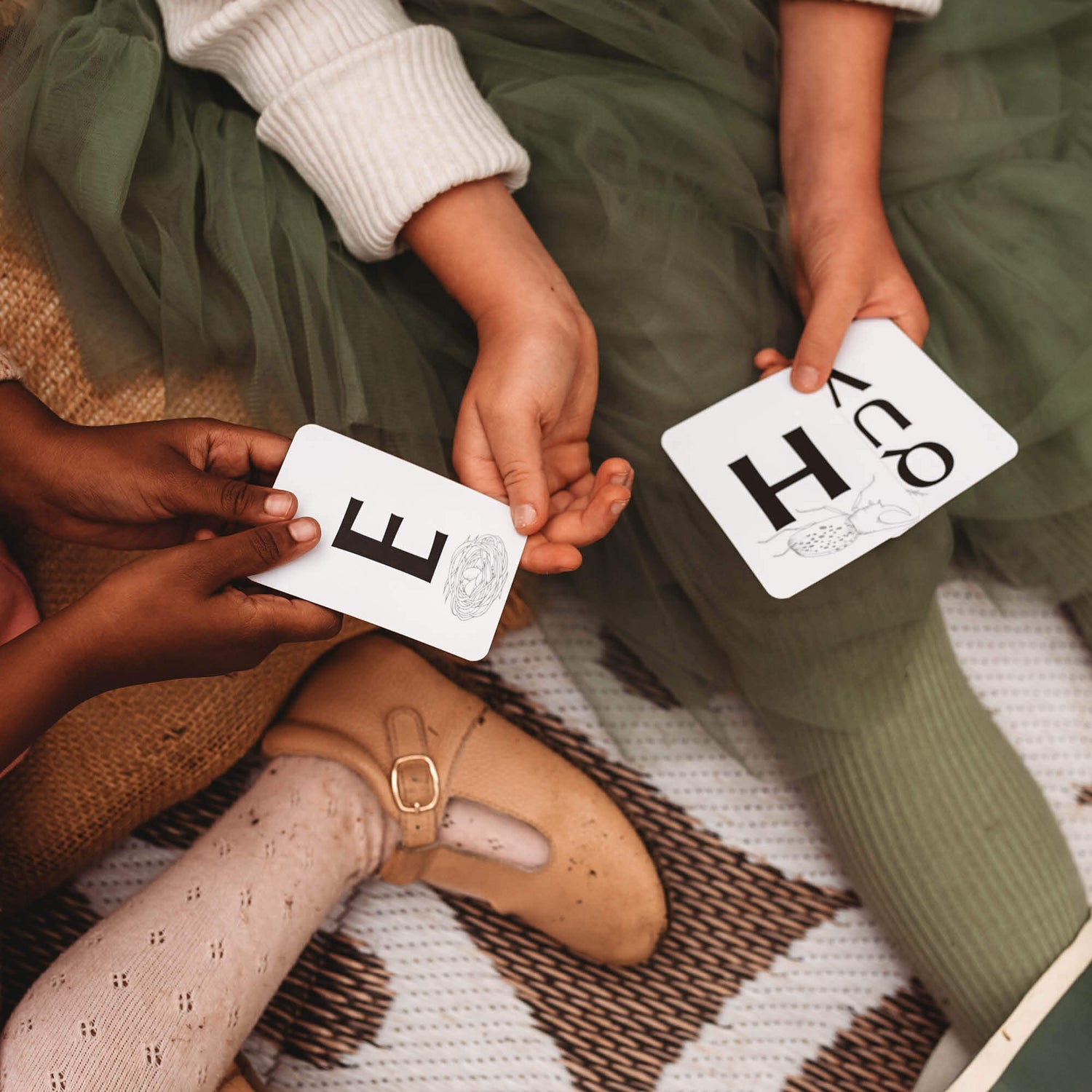 Children playing a nature inspired card game, Your Wild Quiz. Made in Australia by Your Wild Books.