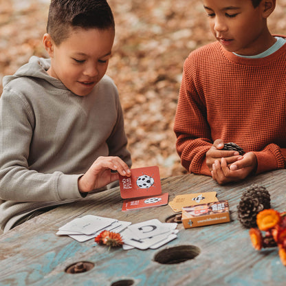 Children playing a nature inspired card game, Your Wild Quiz. Made in Australia by Your Wild Books.