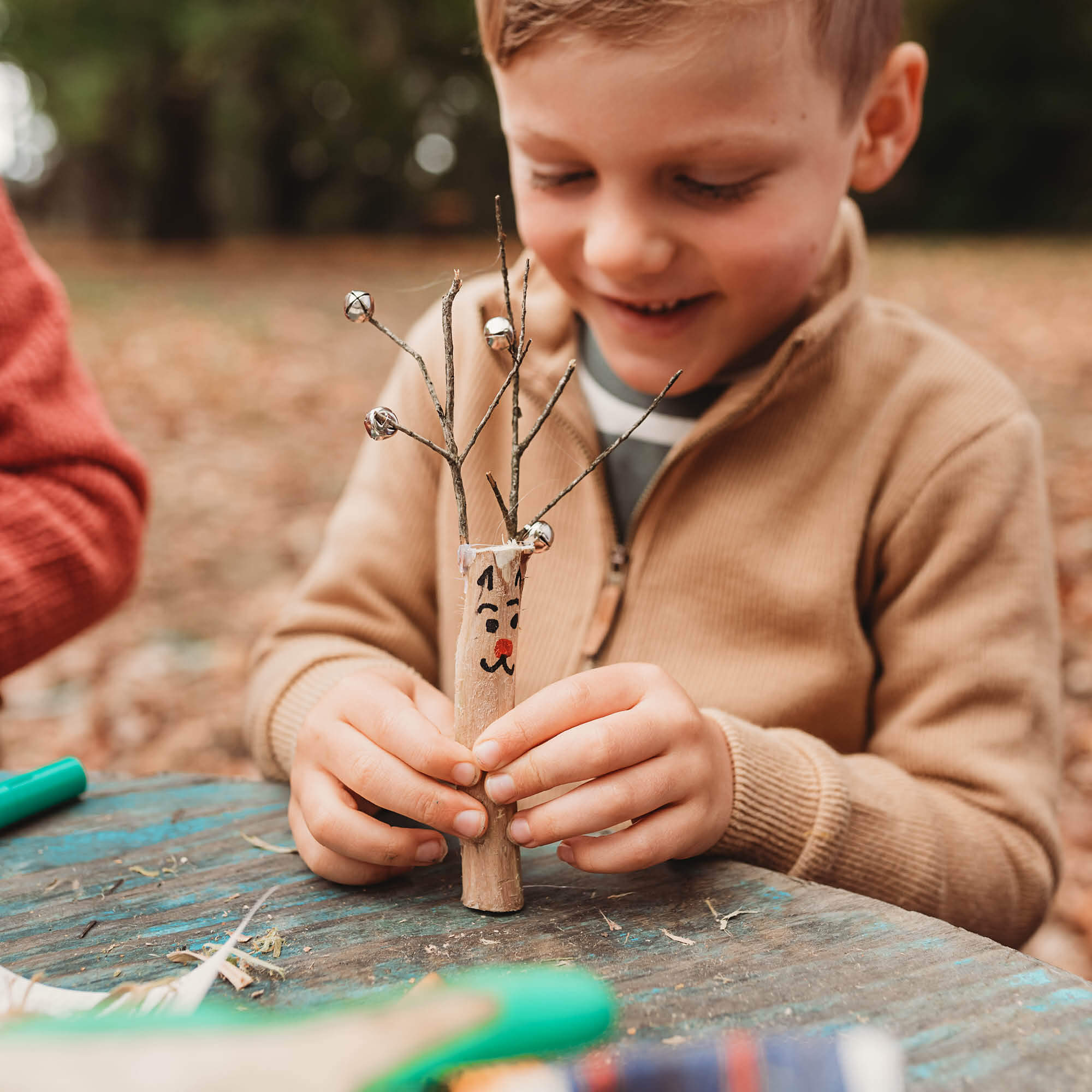 Reindeer made from a whittled stick. Wood whittling knives for kids for all your nature craft projects, suitable for beginners and advanced woodworkers. Made by Opinel from Your Wild Books.