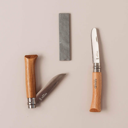 No 7, No 8 and sharpening stone. Wood whittling knives for kids for all your nature craft projects, suitable for beginners and advanced woodworkers. Made by Opinel from Your Wild Books.