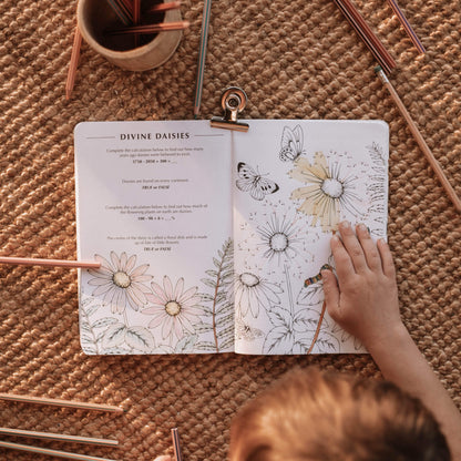 Child doing dot-to-dot activity from Wild Activity Book, nature inspired games and puzzles by Your Wild Books. Made in Australia for kids over 7 years.