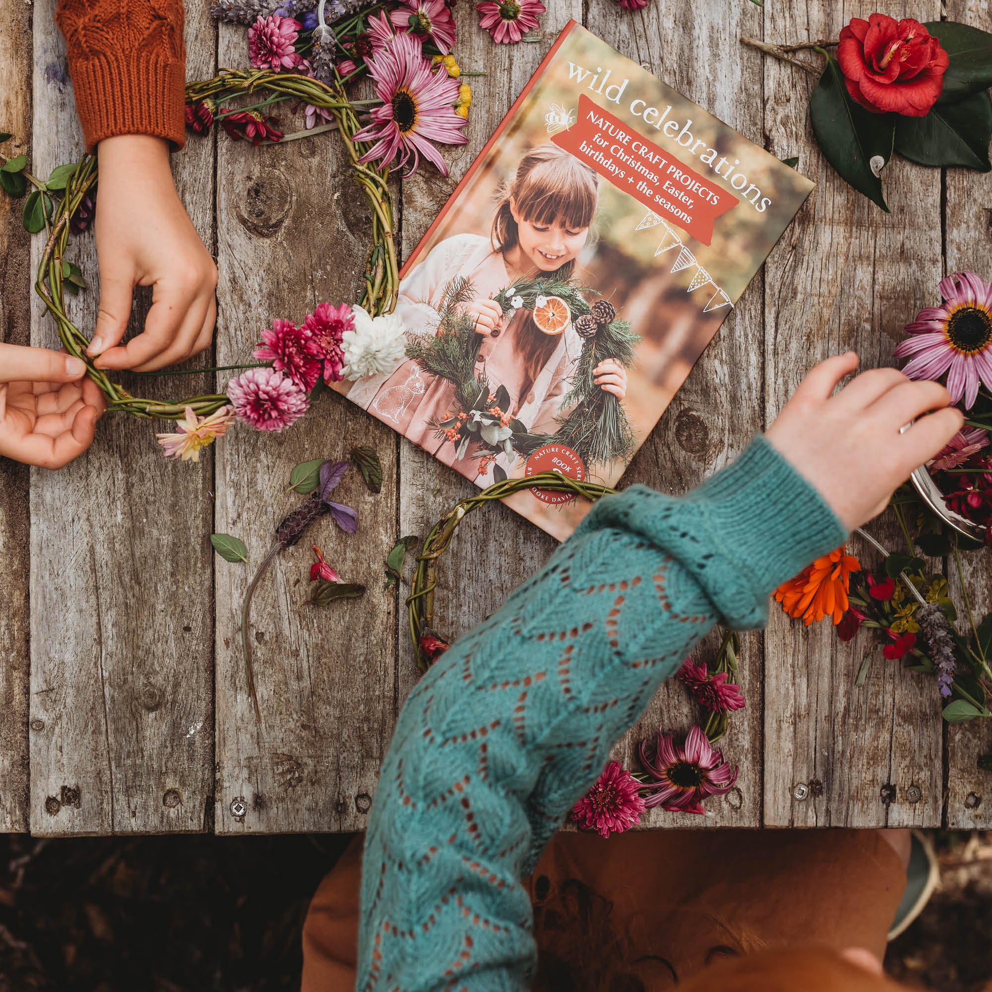 Children making flower crowns using instructions from Wild Celebrations book, with nature craft for Christmas, Easter, the Season and birthday parties. Made in Australia by Your Wild Books.